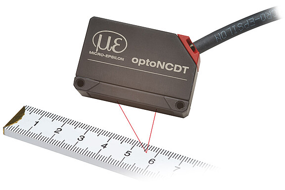 optoNCDT 1420 laser sensor size comparison with meter stick